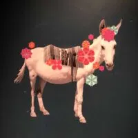 White donkey painted on a green door
