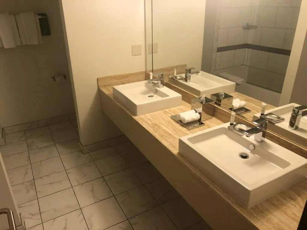 Bathroom with tile floor and 2 sinks