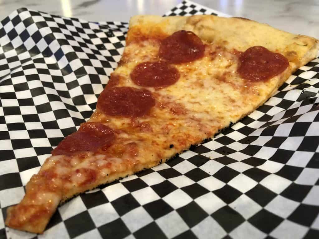Slice of pepperoni pizza from Plaza's Pop Up Pizza