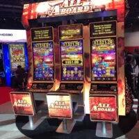 All Abord Slot cabinet with LED screens on the back of player chairs