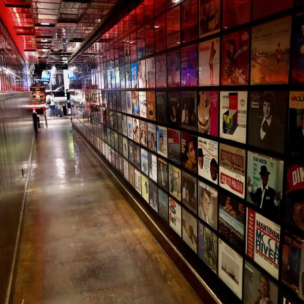 Hallway lined with records leading to Secret Pizza