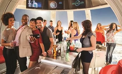 Group of people enjoying drinks on the High Roller