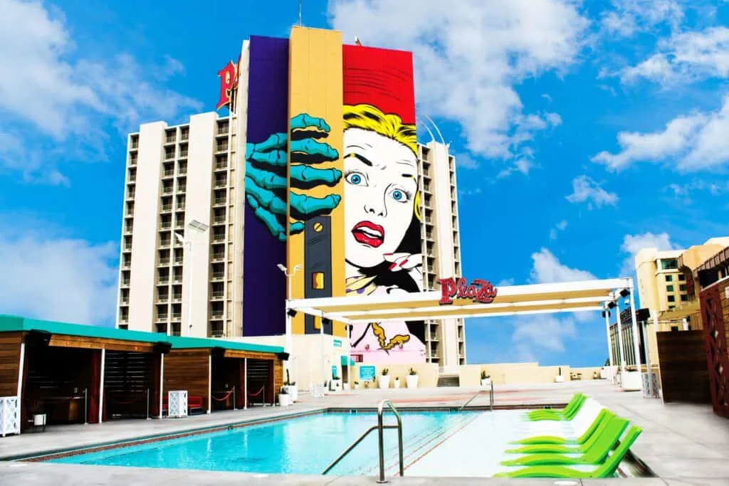 Pool deck at Plaza with hotel tower in the background