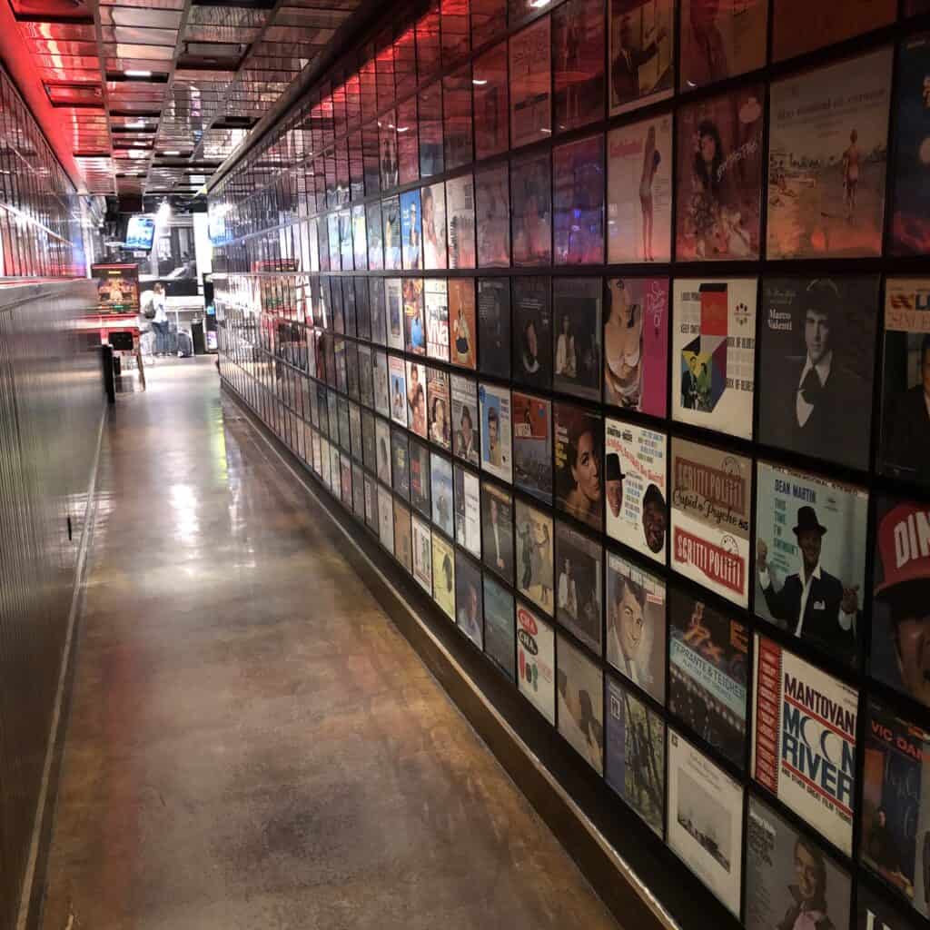 Hallway to Secret Pizza, which is lined with record covers