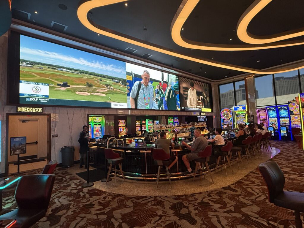 A new video board above a bar. 