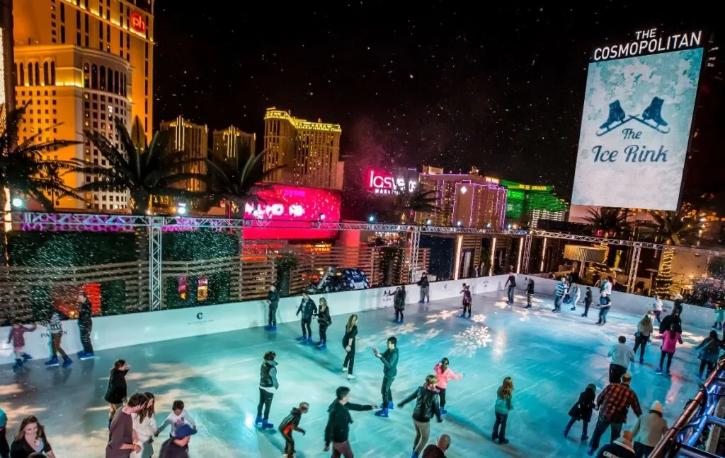 Skaters glide across the ice skating rink at Cosmopolitan.