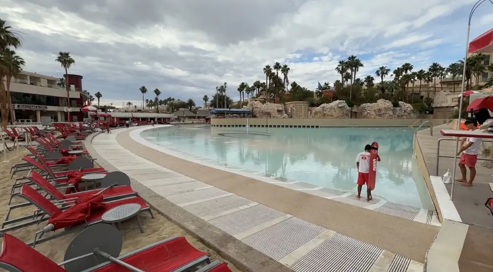 The wave pool, bordered by real sand.