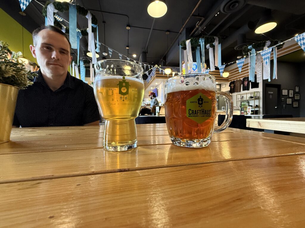 2 beers sit on a table at CraftHaus.
