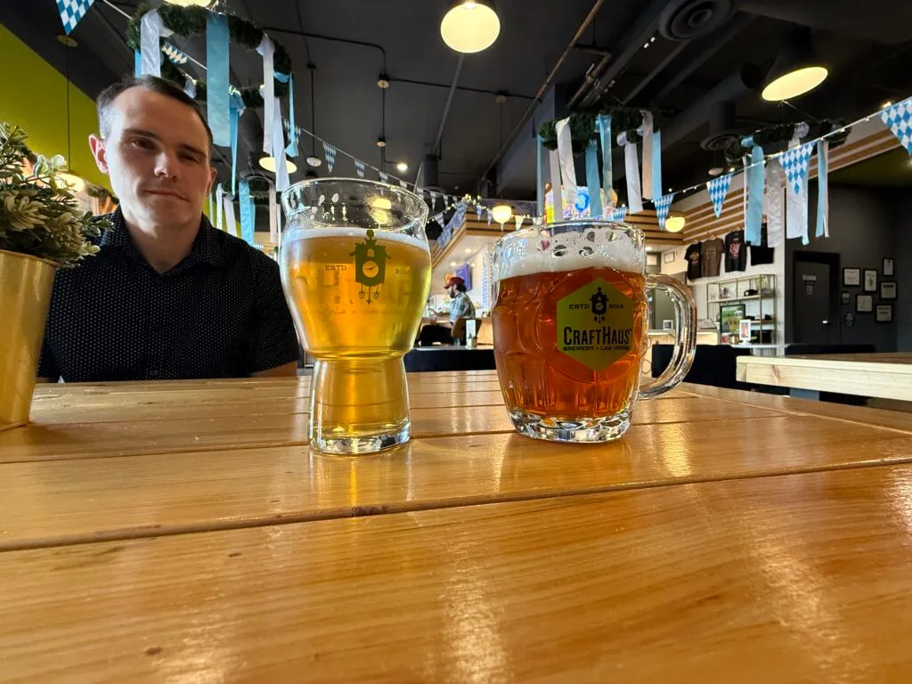 2 beers sit on a table at CraftHaus.