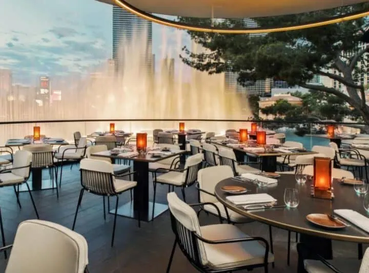 Patio seating at Spago with fountains spraying in the background