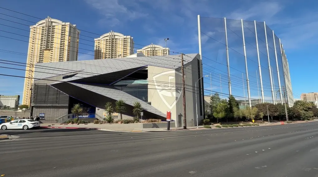 Exterior of Topgolf from across the street. In the background are the 3 Signature at MGM Grand Towers.