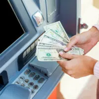 Woman withdrawing cash from an ATM