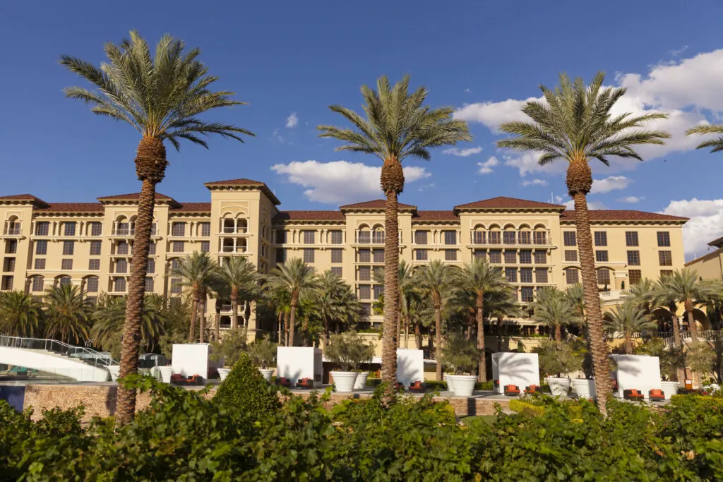 Exterior of Green Valley Ranch with palm trees in the foreground