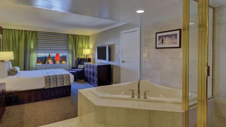Two person tub and bed in Excalibur's suite