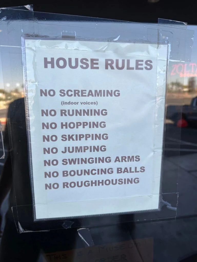 A list of rules, on the door of the pinball hall of fame. 