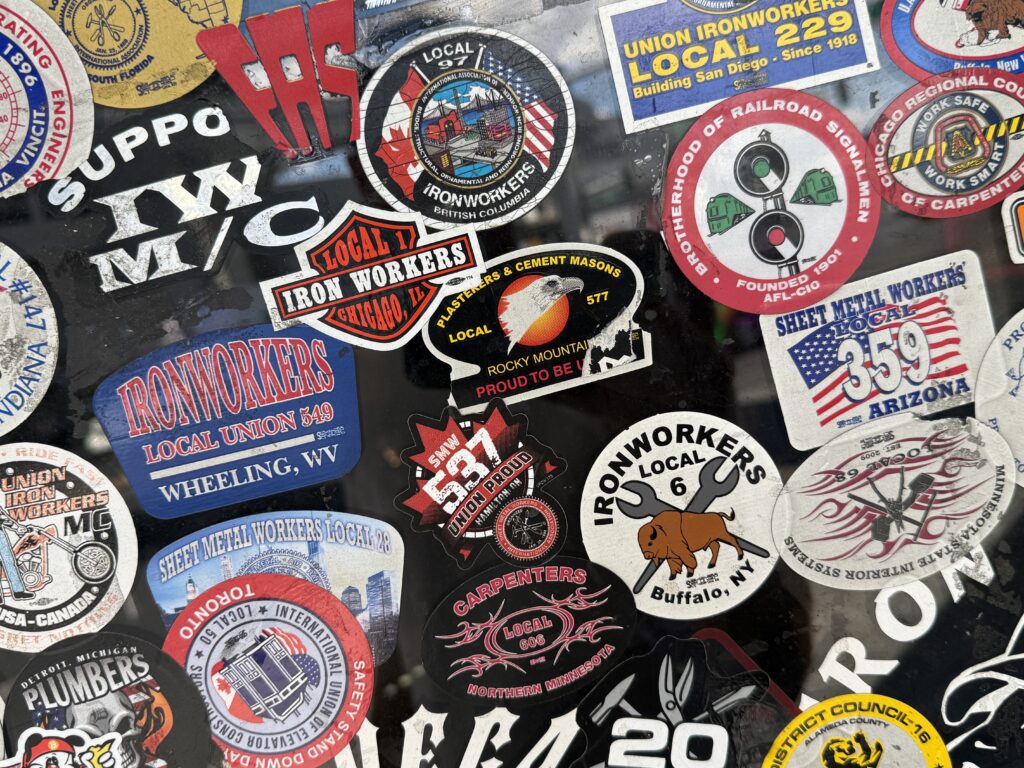 A chaotic collection of stickers plastered to the exterior of Stage Door Casino.