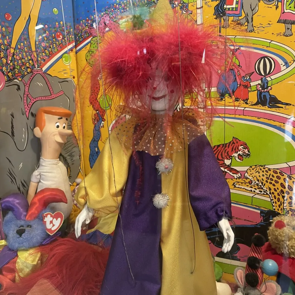 clown with red, crazy hair at the Pinball Hall of Fame