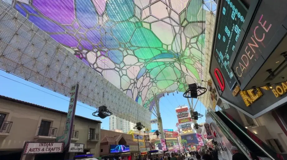 Slotzilla riders gliding under the Fremont Street Experience canopy.