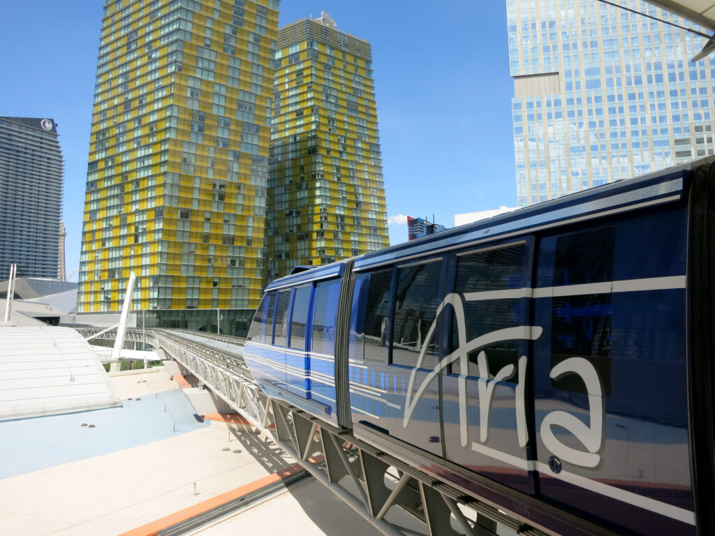 Aria Express tram on the tracks with Veer Towers in the background