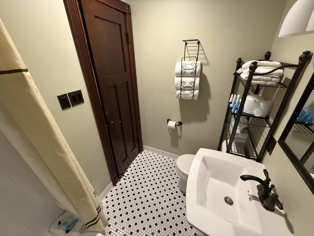 A reverses angle of the bathroom taken from inside the tub. 