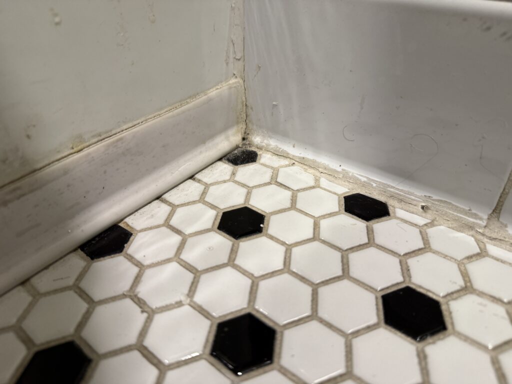 A dusty corner in the bathroom. 