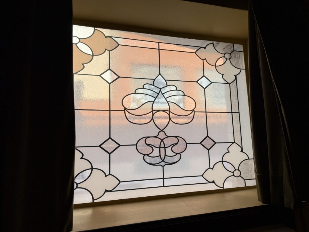 A stained glass window, with minimal view. 