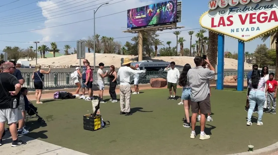 A man pretending to be a photographer. 