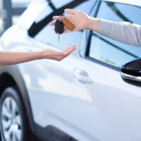 Keys being handed over for a rental car