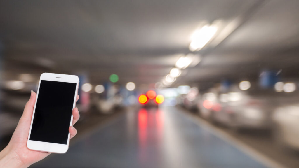 Person holding phone to order a ride share ride