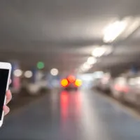 Person holding phone to order a ride share ride