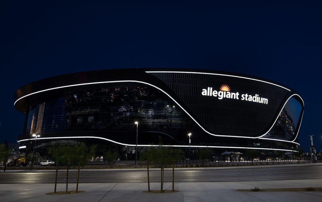 Exterior of Allegiant Stadium at night.