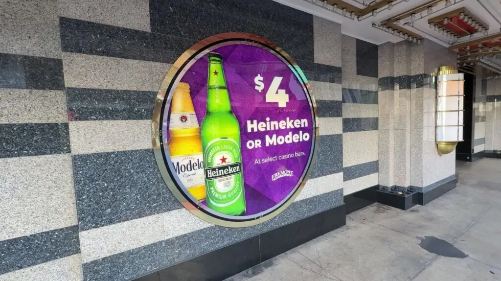 A sign advertising $4 bottles of beer at Boyd properties.