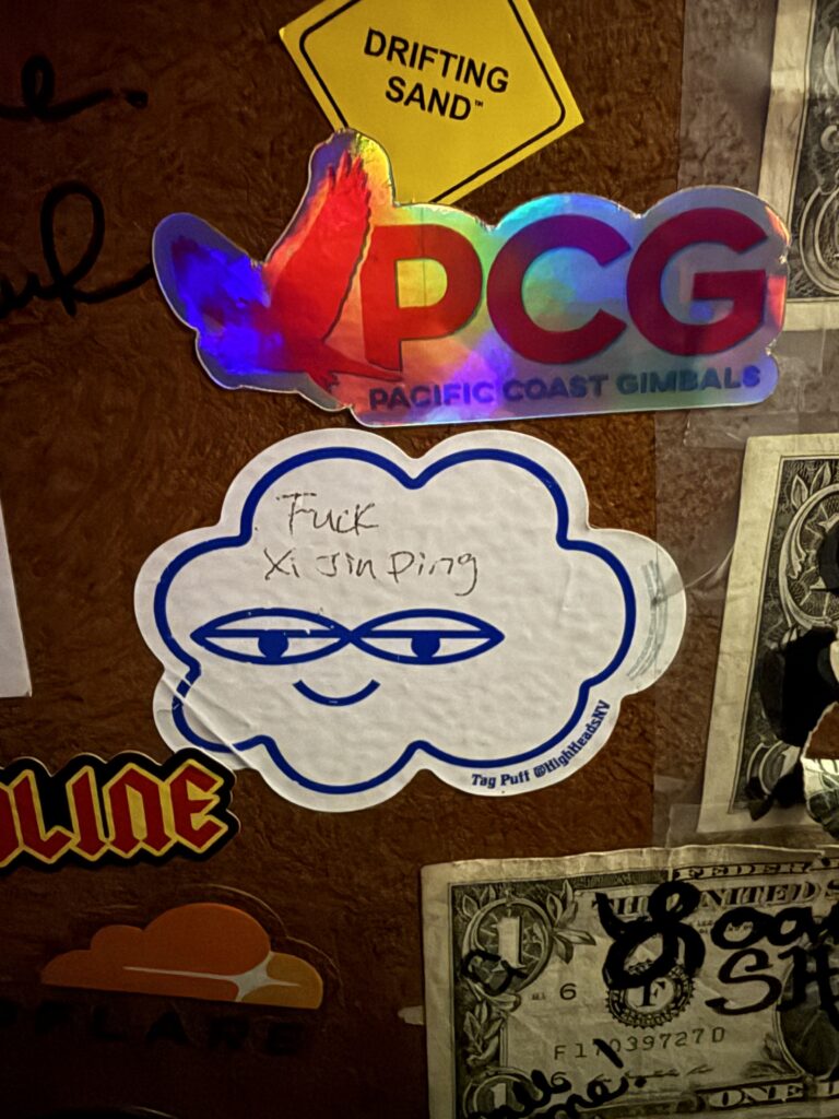 Bumper stickers on the wall at the Ski Lodge.