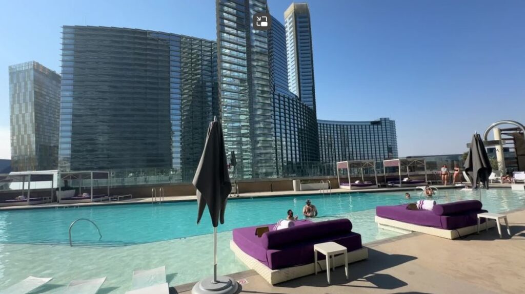 Cosmopolitan's chelsea pool with Aria's hotel tower in the background.