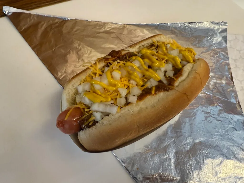 A retro coney dog on tinfoil.