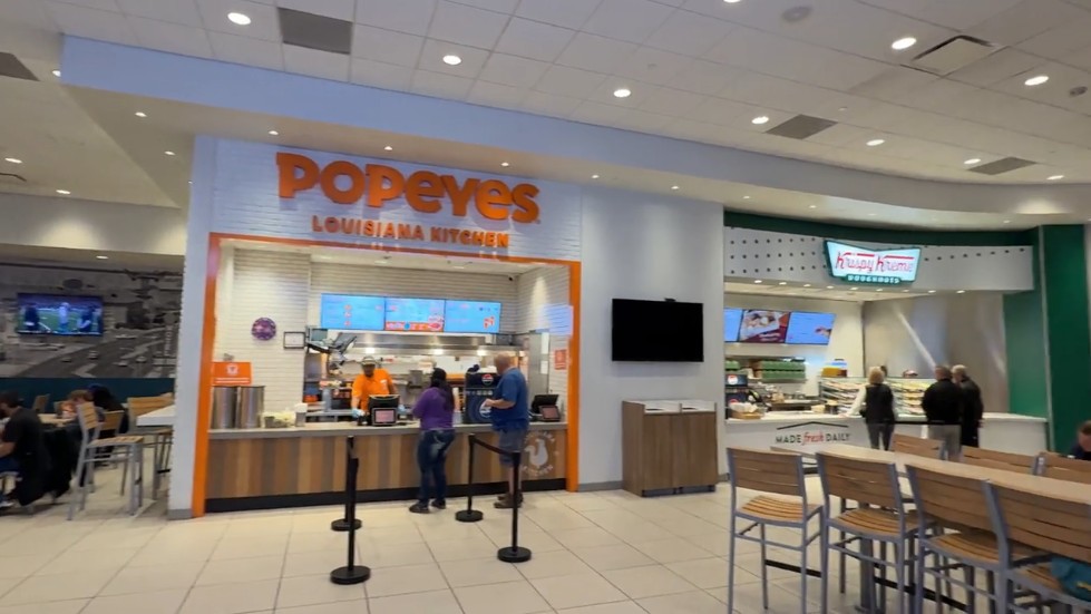 Food court at TI with Popeyes and Krispe Kreme. 