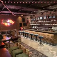 Here Kitty Kitty Vice Den interior to include the bar and seating