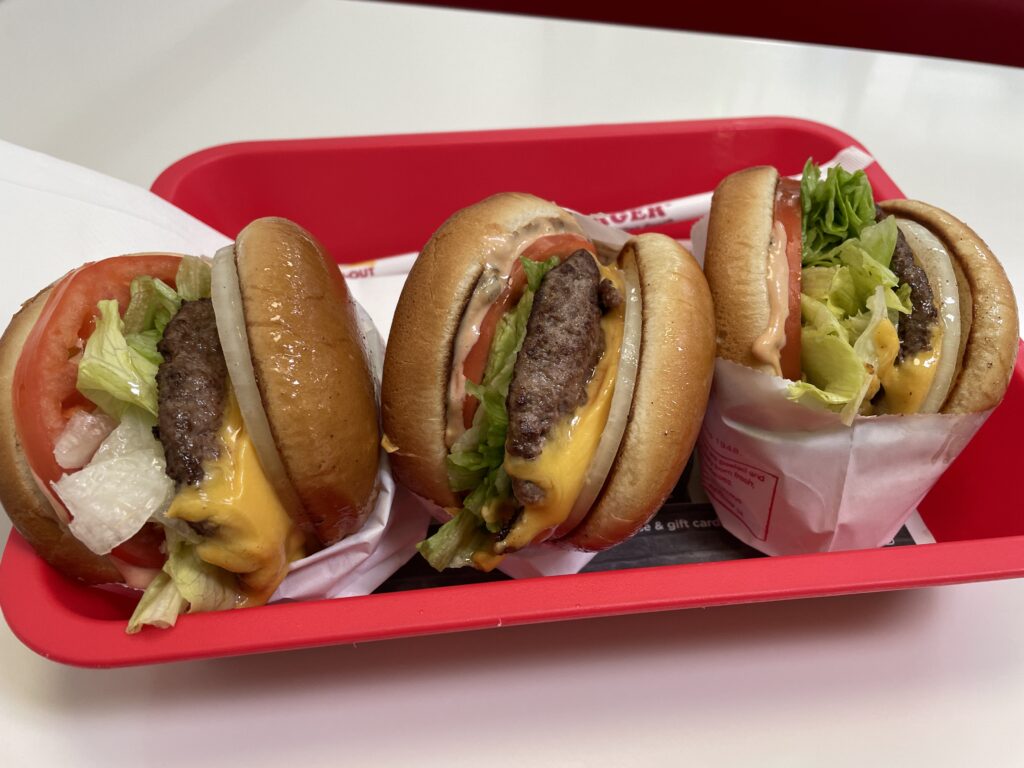 3 burgers on a tray from In N Out. 