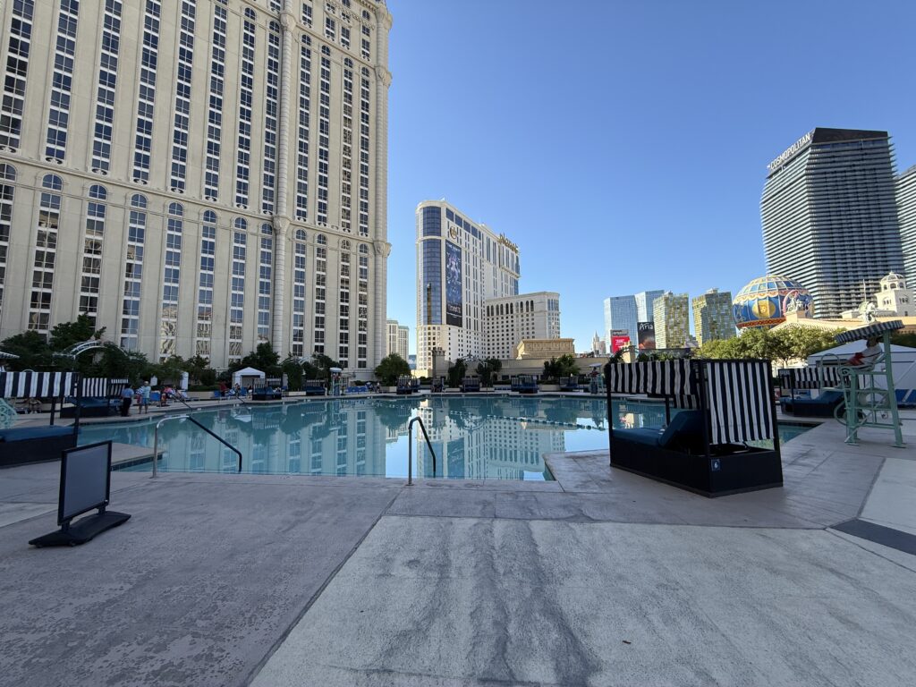 A view from Paris' pool deck that includes Planet Hollywood, Cosmopolitan, and Veer Towers in the background.