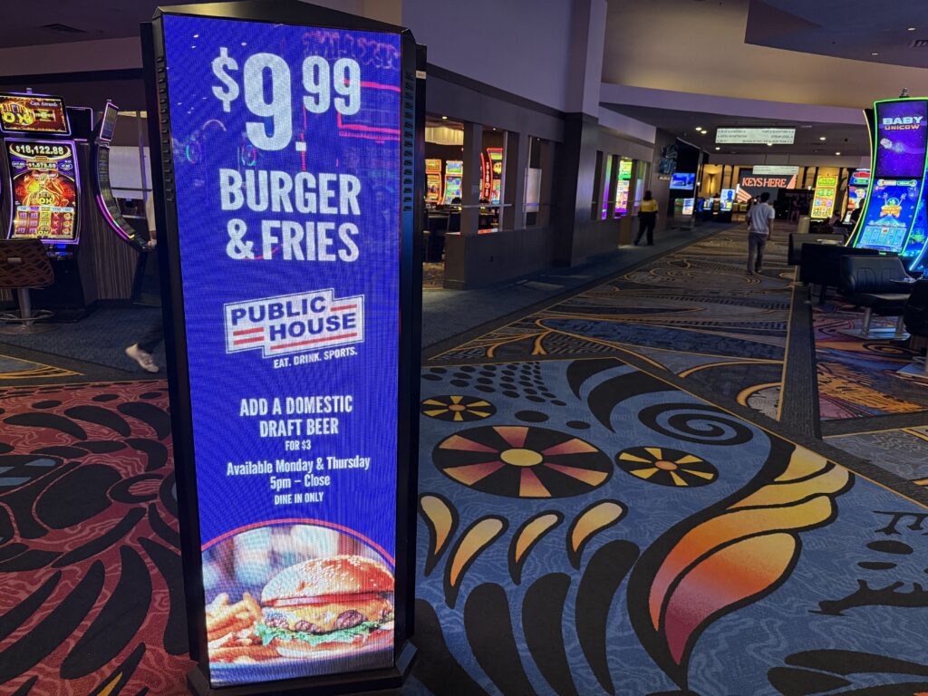 An led sign advertising the burger basket deal.