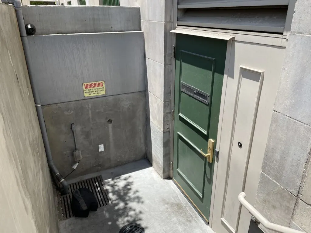 Green door marking the entrance to the Underground Speakeasy