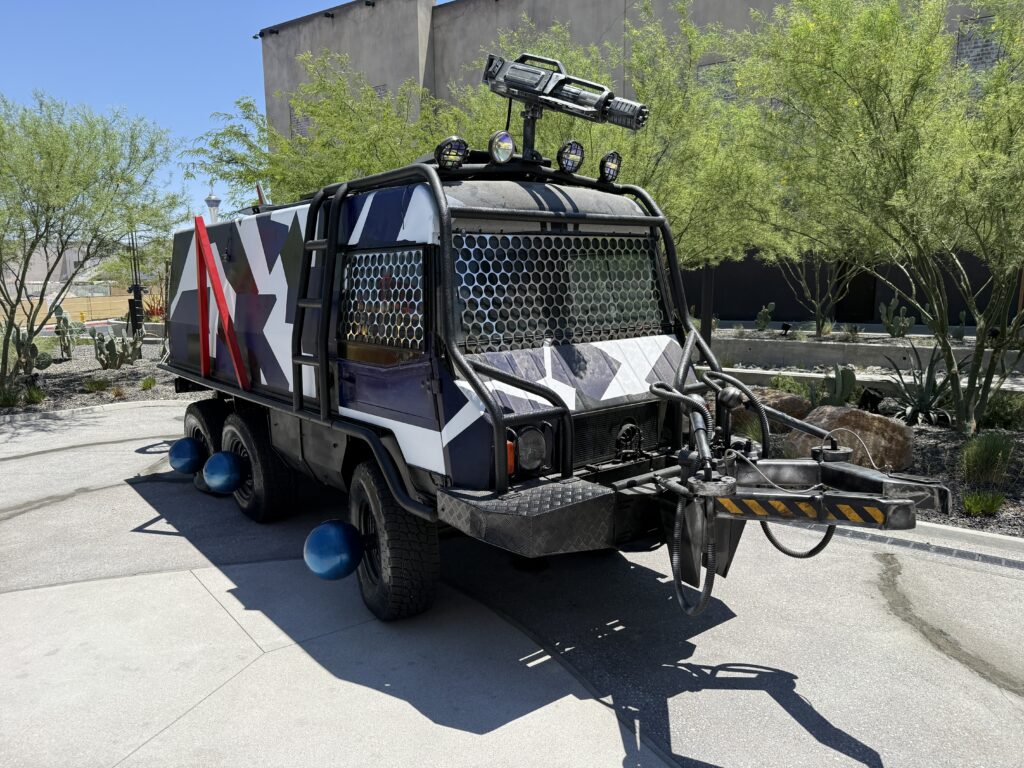 A vehicle with a machine gun mounted atop it, looking ready for a zombie apocolypse.