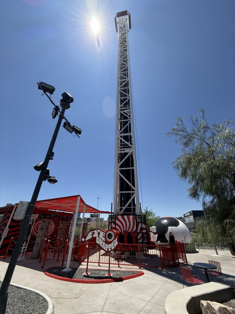 Eye Dropper tower extending into the blue sky.