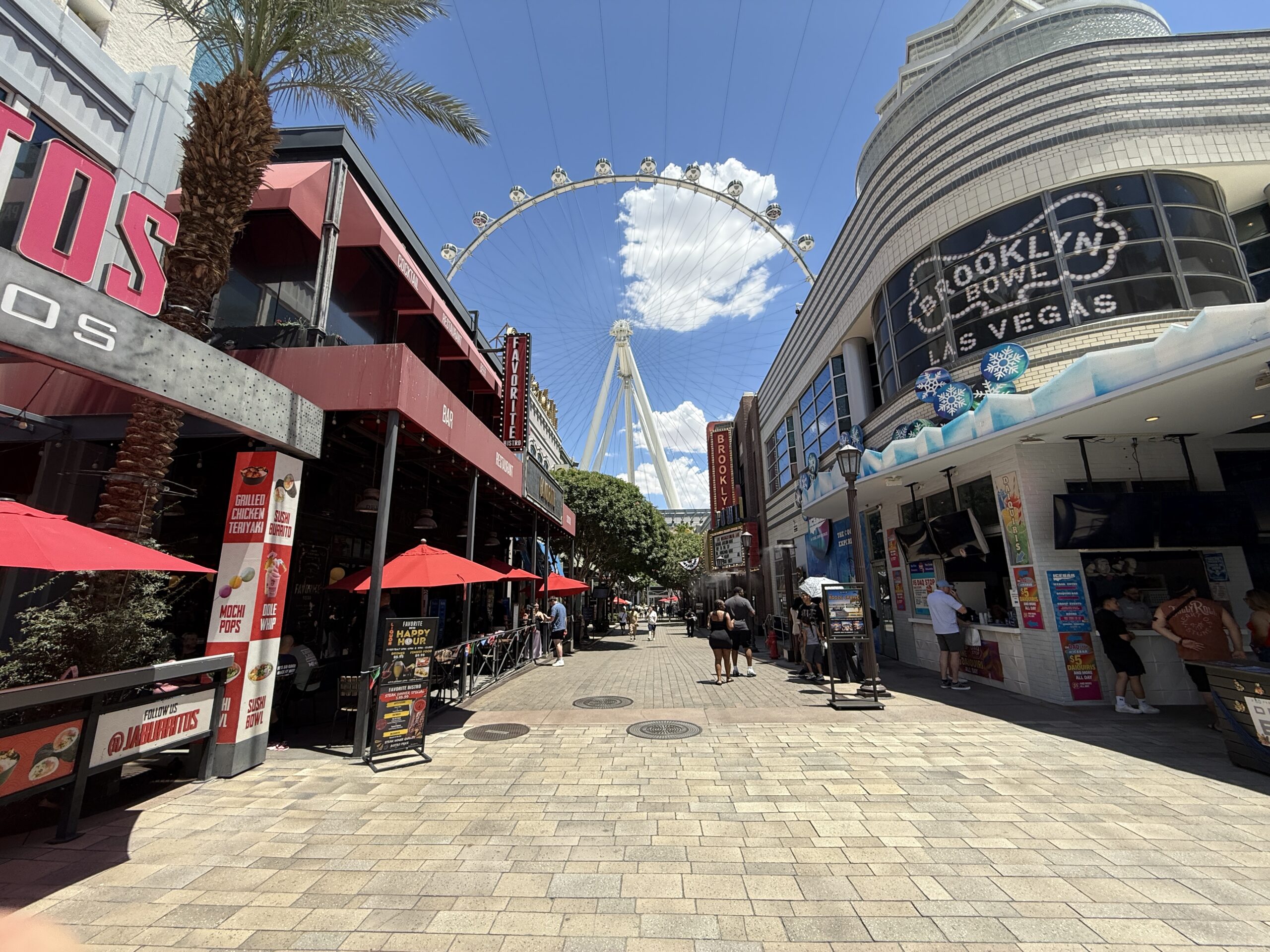 LINQ Promenade, anchored by the high roller observation wheel in the distance.