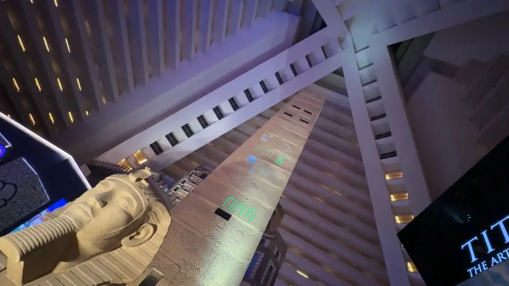 Atrium ceiling with and obolisk and sphinx in the foreground.