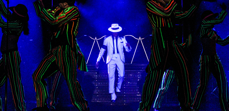 Michael Jackson performer in a white suit onstage