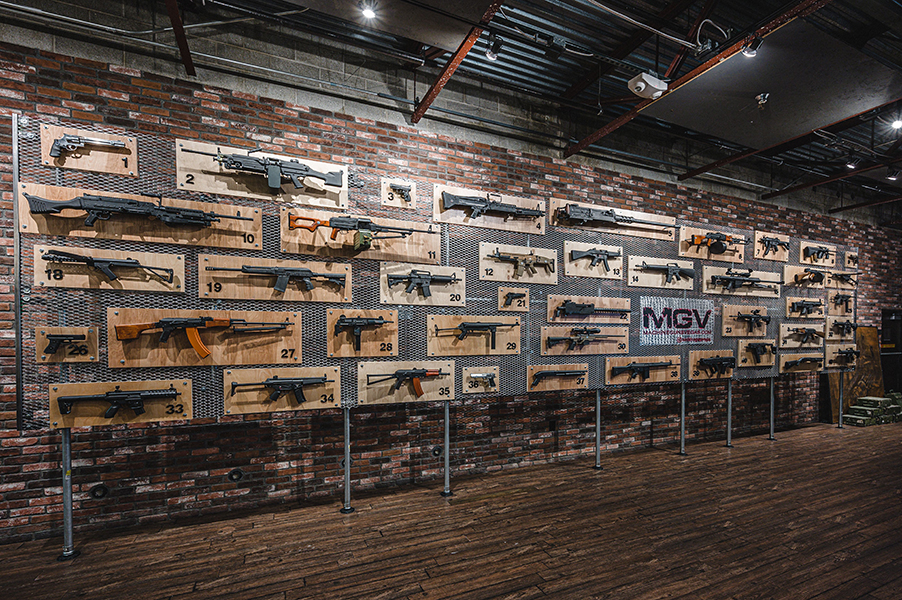 Firearms are displayed on a wall