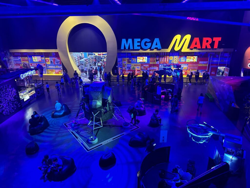 Exterior of Omega Mart photographed from above.
