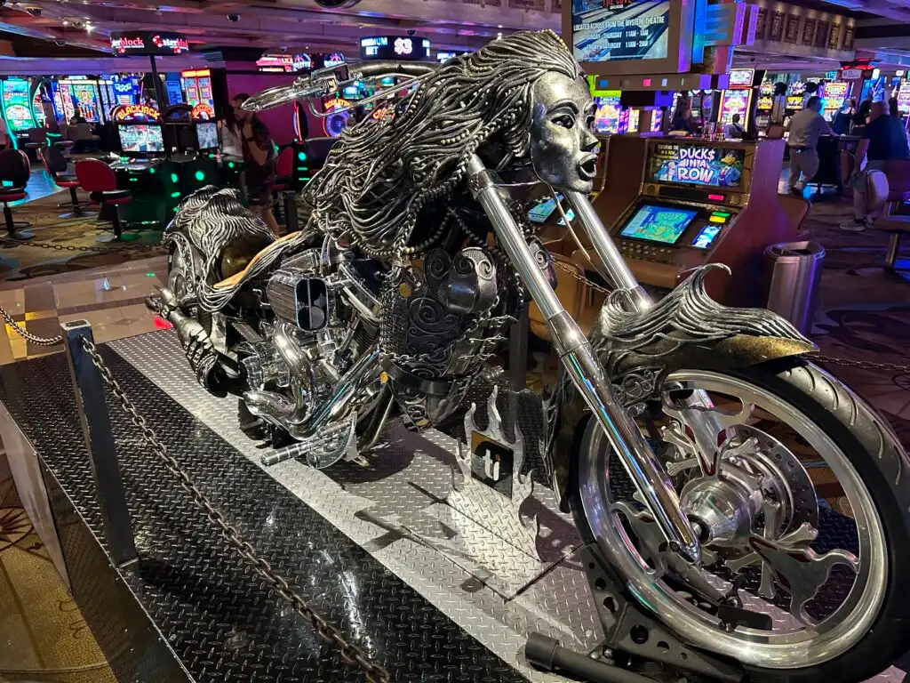 A motorcycle with intricate design that makes it look like a woman. 