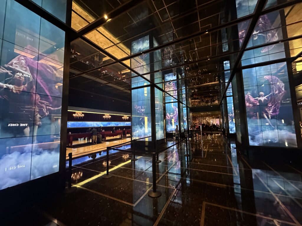 Cosmopolitan's hotel lobby, which has pillars outfitted with LED screens playing media. 